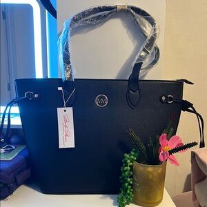 Black Structured Shoulder Bag with Metallic Emblem